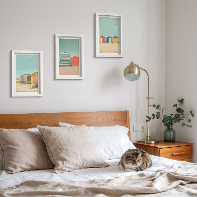 Framed triptych Colorful beach houses in the summer sun