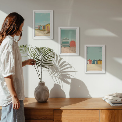 Framed triptych Colorful beach houses in the summer sun