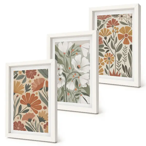 Framed triptych with floral patterns in shades of orange and green