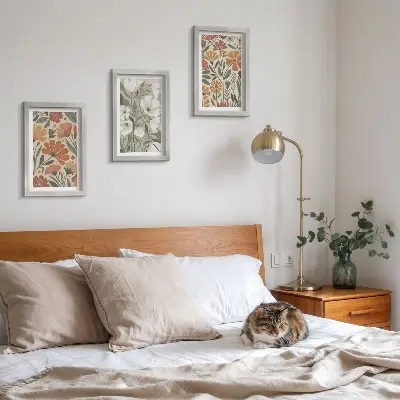 Framed triptych with floral patterns in shades of orange and green