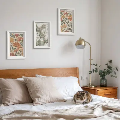 Framed triptych with floral patterns in shades of orange and green