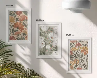 Framed triptych with floral patterns in shades of orange and green