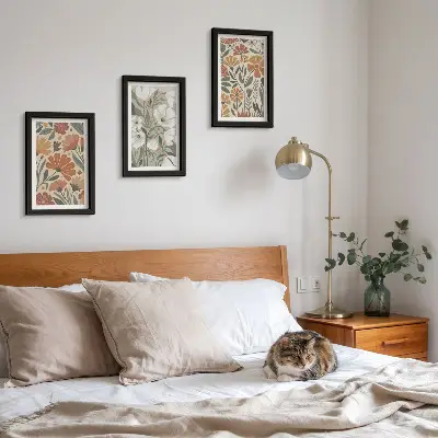 Framed triptych with floral patterns in shades of orange and green