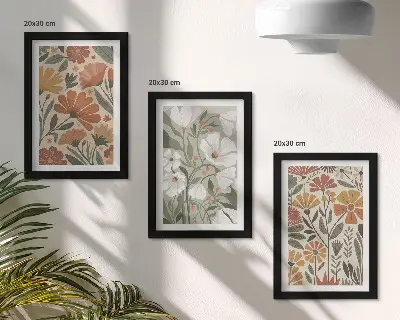 Framed triptych with floral patterns in shades of orange and green