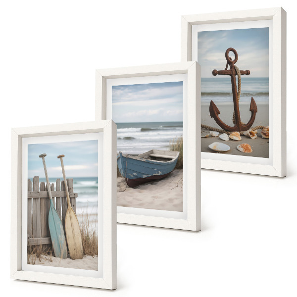 Photo frame wall A beach with a rowboat and an anchor in the sand