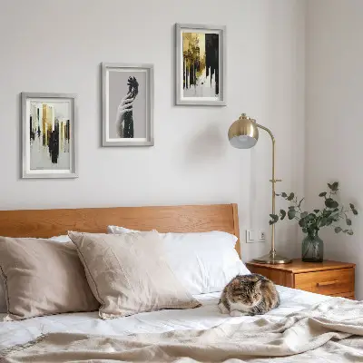 Photo frame wall with abstract painting and two hands motif