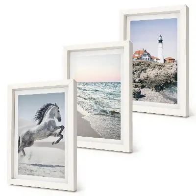 Photo frame wall featuring horses in motion on a beach with a lighthouse and water waves