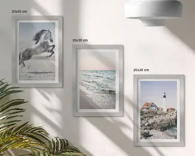 Photo frame wall featuring horses in motion on a beach with a lighthouse and water waves