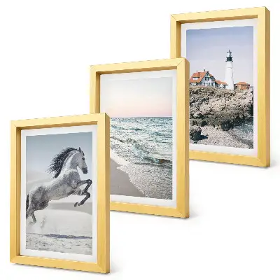 Photo frame wall featuring horses in motion on a beach with a lighthouse and water waves