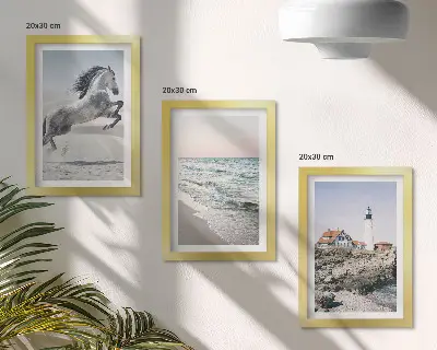 Photo frame wall featuring horses in motion on a beach with a lighthouse and water waves