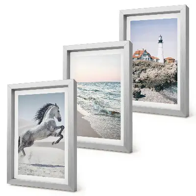 Photo frame wall featuring horses in motion on a beach with a lighthouse and water waves