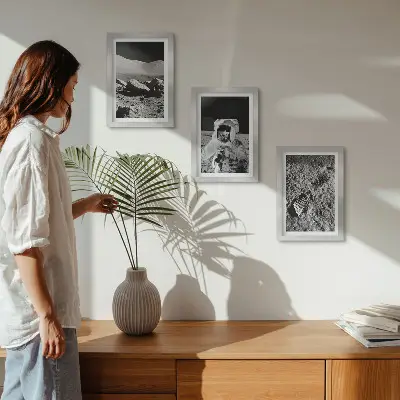 Photo frame wall with moon, astronaut, and footprint prints