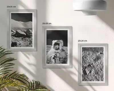 Photo frame wall with moon, astronaut, and footprint prints