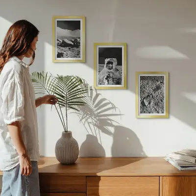 Photo frame wall with moon, astronaut, and footprint prints