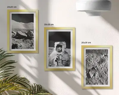 Photo frame wall with moon, astronaut, and footprint prints