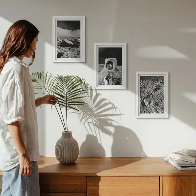 Photo frame wall with moon, astronaut, and footprint prints
