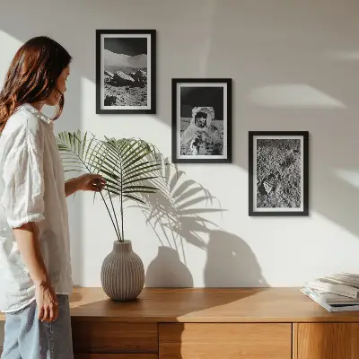 Photo frame wall with moon, astronaut, and footprint prints