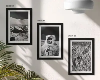Photo frame wall with moon, astronaut, and footprint prints