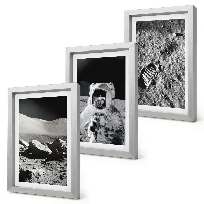 Photo frame wall with moon, astronaut, and footprint prints