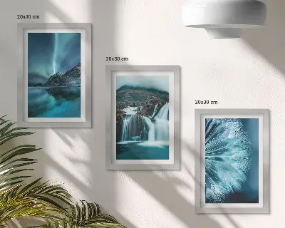 Photo frame wall with winter landscapes showing waterfalls and aurora borealis