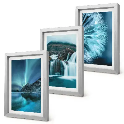Photo frame wall with winter landscapes showing waterfalls and aurora borealis