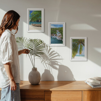 Framed triptych Beach with boat, waterfalls and palm trees in the tropics