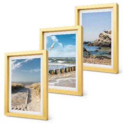 Beach with wooden path, sea and seaside cliffs framed triptych