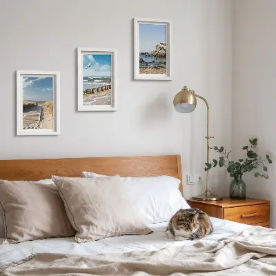 Beach with wooden path, sea and seaside cliffs framed triptych
