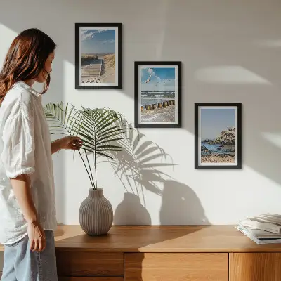 Beach with wooden path, sea and seaside cliffs framed triptych