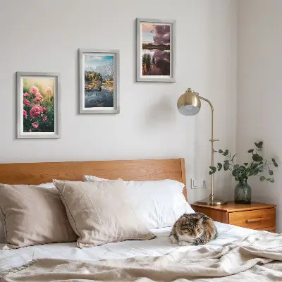 Photo frame wall featuring flowers in a garden, mountains, and a calm water surface