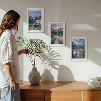 Mountains, lakes and wooden bridges over the water framed triptych