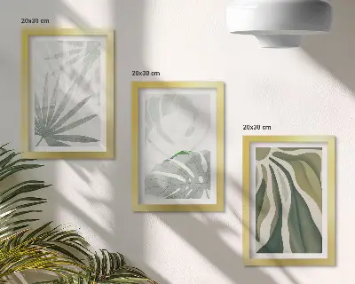 Photo frame wall with green and gray plant leaves