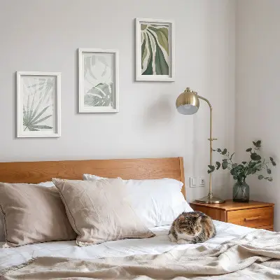 Photo frame wall with green and gray plant leaves