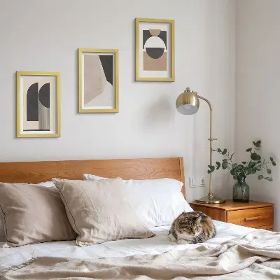 Photo frame wall with abstract shapes in shades of beige and brown