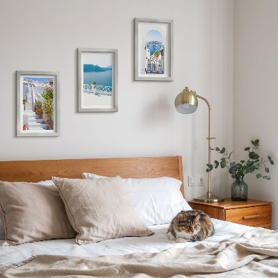 Framed triptych White stairs with plants, sea view and gate