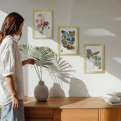 Flowers, butterflies and a bird in pastel shades framed triptych