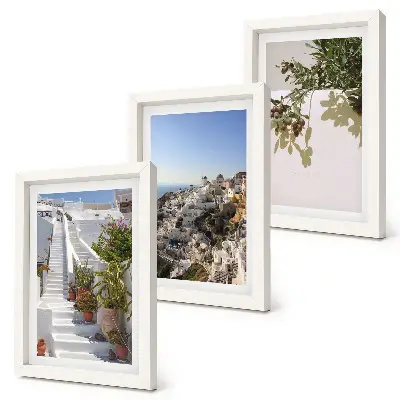 Photo frame wall white stairs in Santorini with a town view