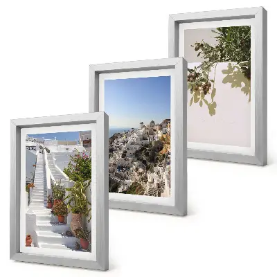 Photo frame wall white stairs in Santorini with a town view