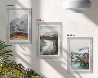 Framed triptych View of the mountains over the lake with a boat and a beach landscape