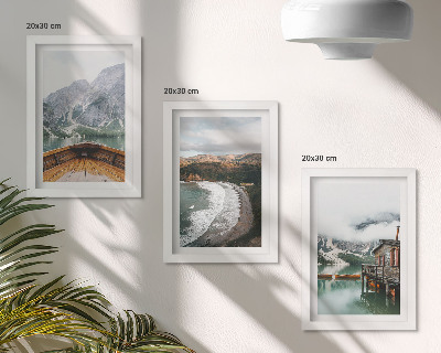 Framed triptych View of the mountains over the lake with a boat and a beach landscape