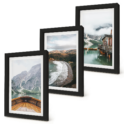 Framed triptych View of the mountains over the lake with a boat and a beach landscape