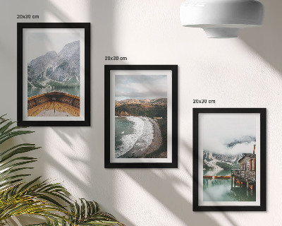 Framed triptych View of the mountains over the lake with a boat and a beach landscape