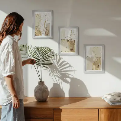 Photo frame wall with abstract patterns in shades of beige and white