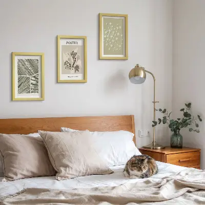 Photo frame wall with plant motifs in subdued colors and patterns