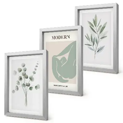 Photo frame wall gallery with delicate green plant motifs