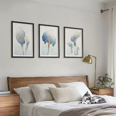 Three-piece wall art set with blue flowers on the background