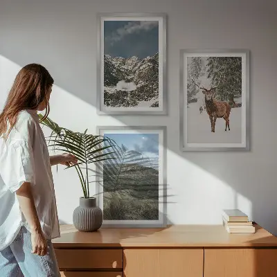 Set of 3 framed wall art pieces featuring a snowy mountain forest and deer landscape