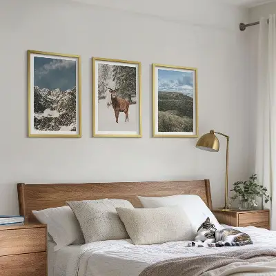 Set of 3 framed wall art pieces featuring a snowy mountain forest and deer landscape