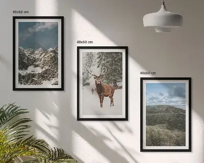 Set of 3 framed wall art pieces featuring a snowy mountain forest and deer landscape