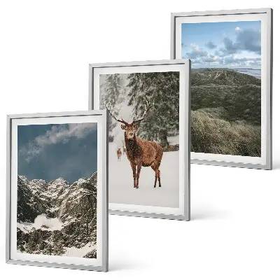Set of 3 framed wall art pieces featuring a snowy mountain forest and deer landscape